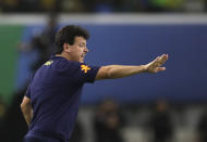 Brazil's coach Fernando Diniz gives instructions to his players during a qualifying soccer match for the FIFA World Cup 2026 against Bolivia at Mangueirao stadium in Belem, Brazil, Friday, Sept. 8, 2023. (AP Photo/Bruna Prado)