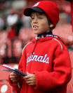 ST LOUIS, MO - OCTOBER 19: A young fan of the St. Louis Cardinals gets ready for during Game One of the MLB World Series between the Texas Rangers and the St. Louis Cardinals at Busch Stadium on October 19, 2011 in St Louis, Missouri. (Photo by Ezra Shaw/Getty Images)