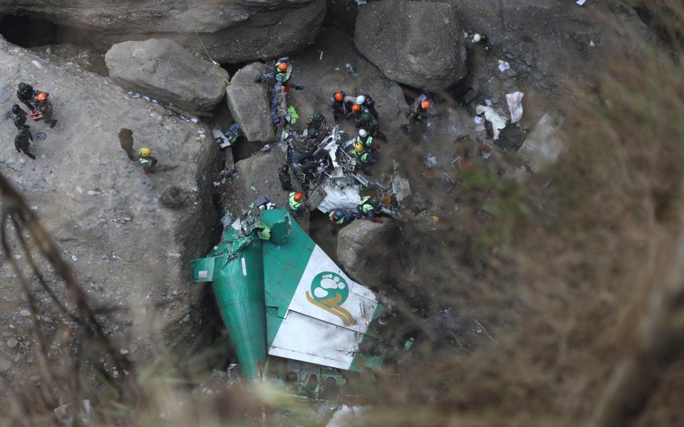 Nepalese army along with the police personnel recover the bodies from the wreckage of domestic Yeti Airlines that crashed with 72 people on board dead in Pokhara, Nepal on Monday, January 16, 2023.