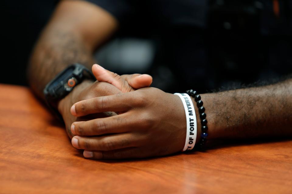 The hands of Fort Myers Police officer Ian McMillion are visible during an interview with The News-Press on Friday, July 28, 2022.