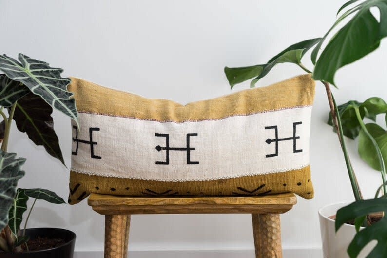 This Spanish Etsy shop sells a selection of "ethnic home textiles" and decor like pillows and blankets. Shop this <a href="https://fave.co/3cR4gvc" target="_blank" rel="noopener noreferrer">maroon mud Bogolan lumbar pillow for $40</a> at <a href="https://fave.co/2Ae658n" target="_blank" rel="noopener noreferrer">Aishea Home on Etsy</a>.