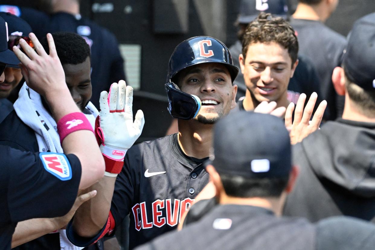 Guardians second base Andres Gimenez celebrates in the dugout after he homers against the White Sox during the fourth inning, May 12, 2024, in Chicago.