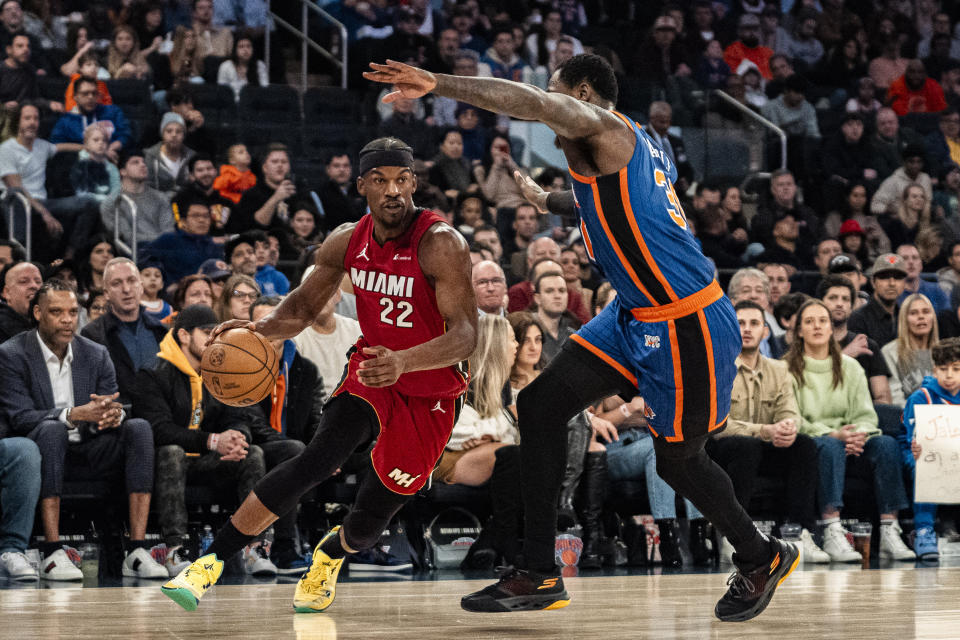 Miami Heat forward Jimmy Butler (22) drives to the basket as New York Knicks forward Julius Randle (30) defends during the first half of an NBA basketball game on Saturday, Jan. 27, 2024, in New York. (AP Photo/Peter K. Afriyie)