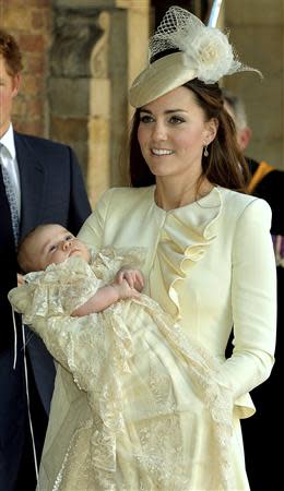 Britain's Catherine, Duchess of Cambridge carries her son Prince George after his christening at St James's Palace in London October 23, 2013. REUTERS/John Stillwell/pool