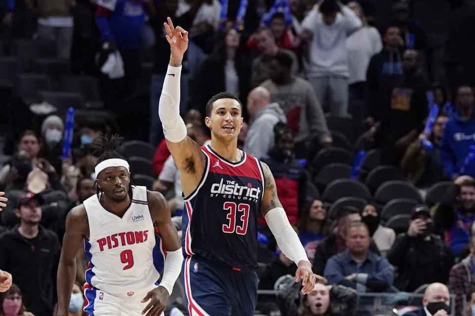 Washington Wizards forward Kyle Kuzma (33) reacts after hitting a 3-point basket in the closing seconds during overtime to defeat the Detroit Pistons in an NBA basketball game, Wednesday, Dec. 8, 2021, in Detroit. (AP Photo/Carlos Osorio)