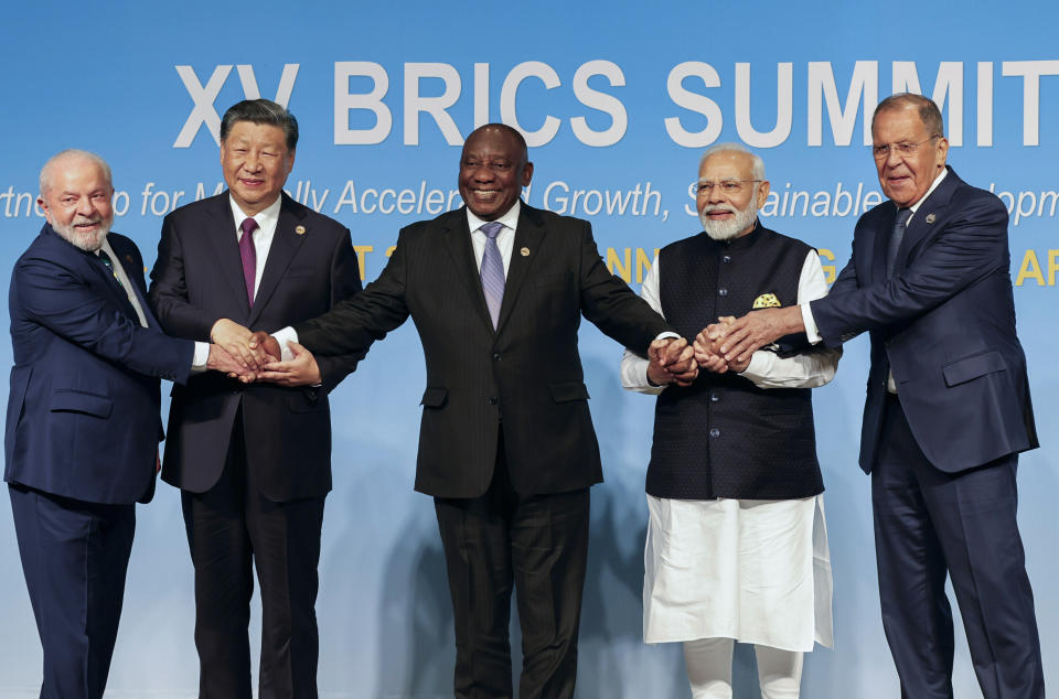 From left, Brazil's President Luiz Inacio Lula da Silva, China's President Xi Jinping, South Africa's President Cyril Ramaphosa, India's Prime Minister Narendra Modi and Russia's Foreign Minister Sergei Lavrov pose for a BRICS group photo during the 2023 BRICS Summit at the Sandton Convention Centre in Johannesburg, South Africa, Wednesday, Aug. 23, 2023. (Gianluigi Guercia/Pool via AP)