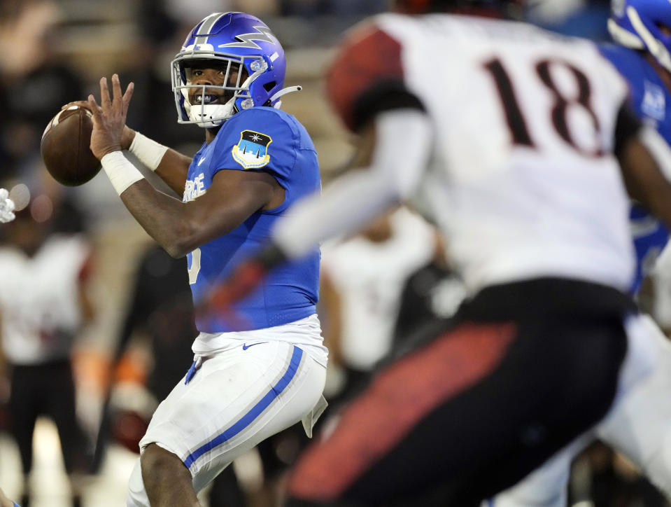 Air Force quarterback Warren Bryan, left, looks to throw a pass as San Diego State safety Trenton Thompson drops back to defend in the second half of an NCAA college football game Saturday, Oct. 23, 2021, at Air Force Academy, Colo. (AP Photo/David Zalubowski)