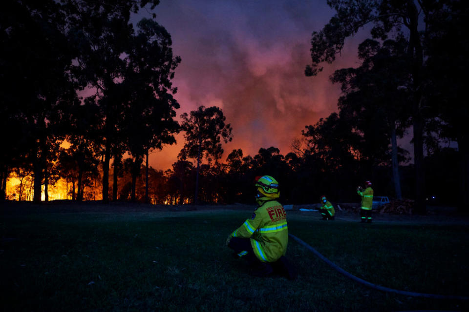 COLO HEIGHTS, AUSTRALIA - NOVEMBER 15: Fire crews wait at a property along Putty road as the fire front approaches on November 15, 2019 in Colo Heights, Australia. The warning has been issued for a 80,000-hectare blaze at Gospers Mountain, which is burning in the direction of Colo Heights. An estimated million hectares of land has been burned by bushfire across Australia following catastrophic fire conditions - the highest possible level of bushfire danger - in the past week. A state of emergency was declared by NSW Premier Gladys Berejiklian on Monday 11 November and is still in effect, giving emergency powers to Rural Fire Service Commissioner Shane Fitzsimmons and prohibiting fires across the state. Four people have died following the bushfires in NSW this week. (Photo by Brett Hemmings/Getty Images)