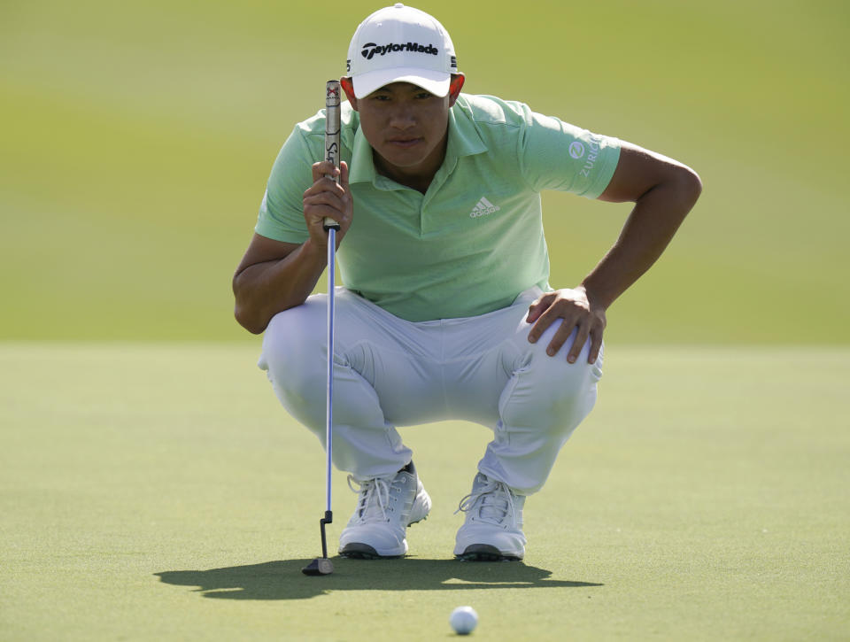 Collin Morikawa of the United States, lines up his putt on the third green during the second round of the Hero World Challenge PGA Tour at the Albany Golf Club, in New Providence, Bahamas, Friday, Dec. 3, 2021.(AP Photo/Fernando Llano)