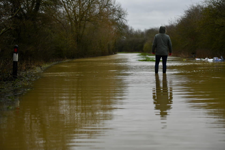 A man walks in Broome Lane in East Goscote, Leicestershire.