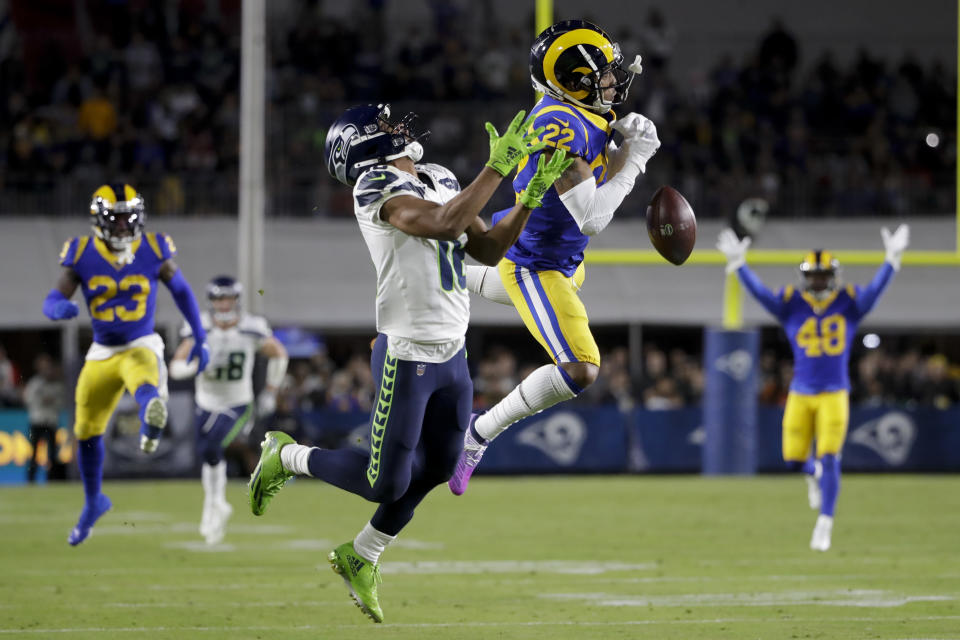 Los Angeles Rams cornerback Troy Hill breaks up a pass intended for Seattle Seahawks wide receiver Tyler Lockett during the first half of an NFL football game Sunday, Dec. 8, 2019, in Los Angeles. (AP Photo/Marcio Jose Sanchez)