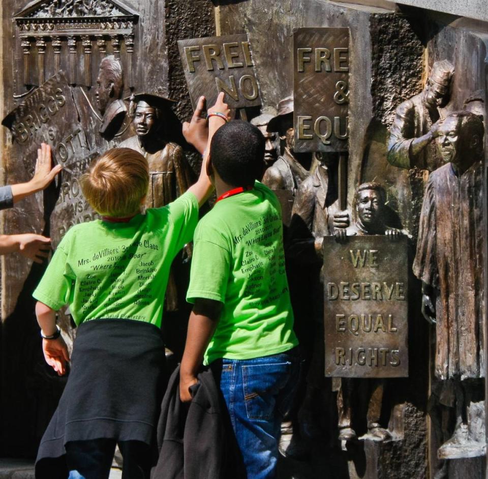 Students from North Myrtle Beach Elementary look at the African American History Monument on the S.C. State House grounds in April 2011.