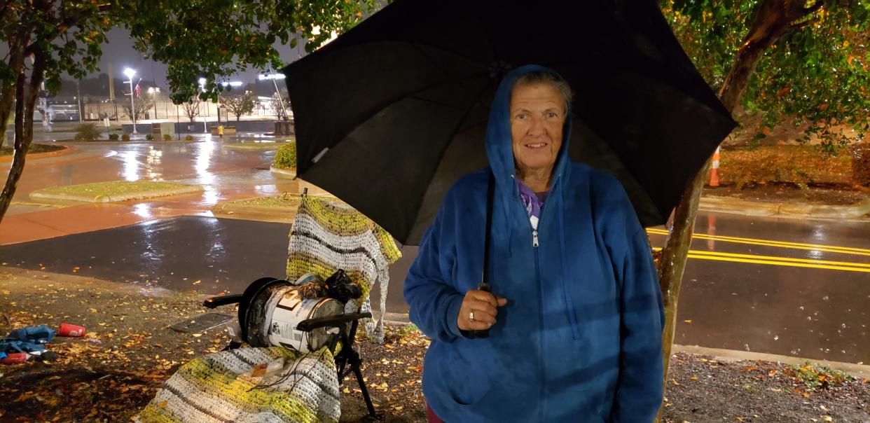 Sharman Tober, who lives at a campsite in a minivan she shares with her son near the Headquarters Library, called the issuance of citations for camping 'asinine' and said the city of Fayetteville should help and not hinder people. She is shown on Thursday evening on Nov. 10, 2022.