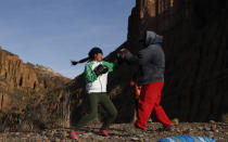 Gracce Kelly Flores, a 12-year-old boxer who goes by the nickname Hands of Stone, does her daily boxing workout as she trains with her father Alberto Flores in Palca, Bolivia, early Thursday, June 10, 2021, amid the COVID-19 pandemic. At age 8, Flores defeated a 10-year-old boy, and with three national boxing medals under her belt, she dreams of reaching the women's boxing world championship. (AP Photo/Juan Karita)