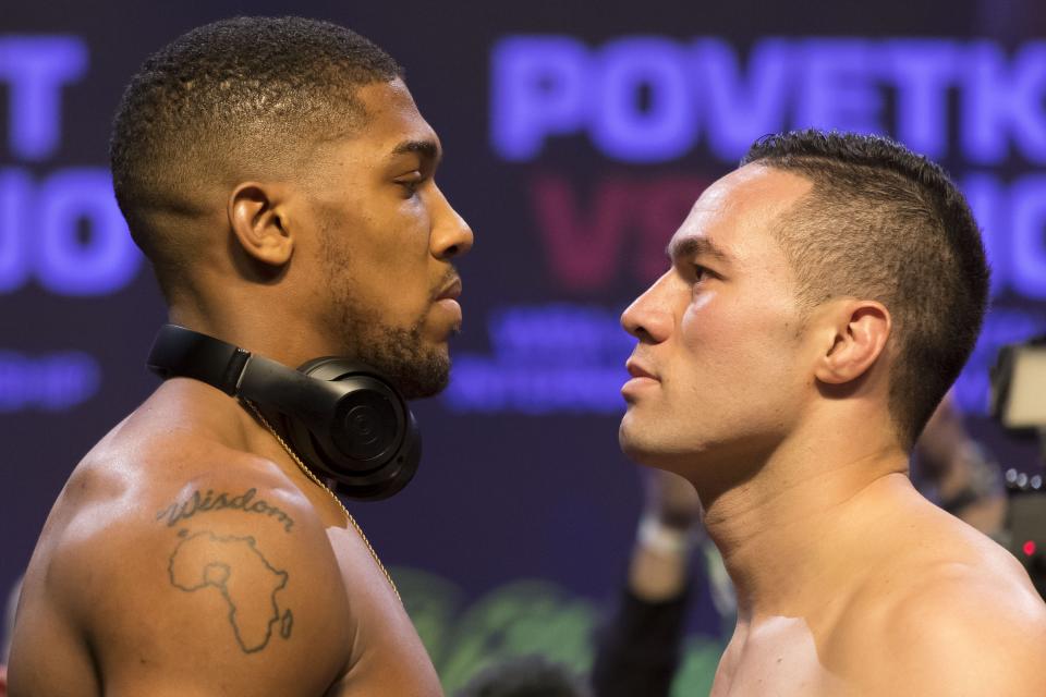 Anthony Joshua (L) and Joseph Parker weigh in at the Motorpoint Arena on Friday in Cardiff, Wales. (Getty Images)
