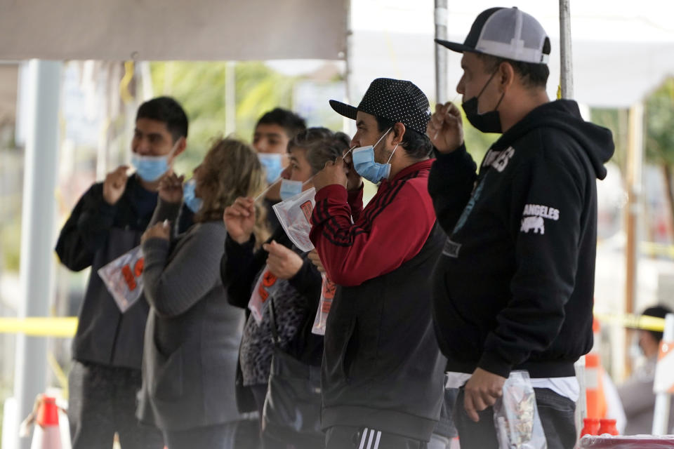 People take a COVID-19 test on the Martin Luther King Jr. Medical Campus, Thursday, Jan. 7, 2021, in Los Angeles. (AP Photo/Marcio Jose Sanchez)