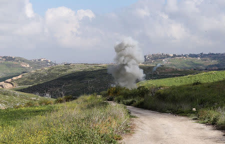 Smoke rises from the Israeli drone after it crashed in Beit Yahoun village, in southern Lebanon, March 31, 2018. REUTERS/ Hasan Shaaban