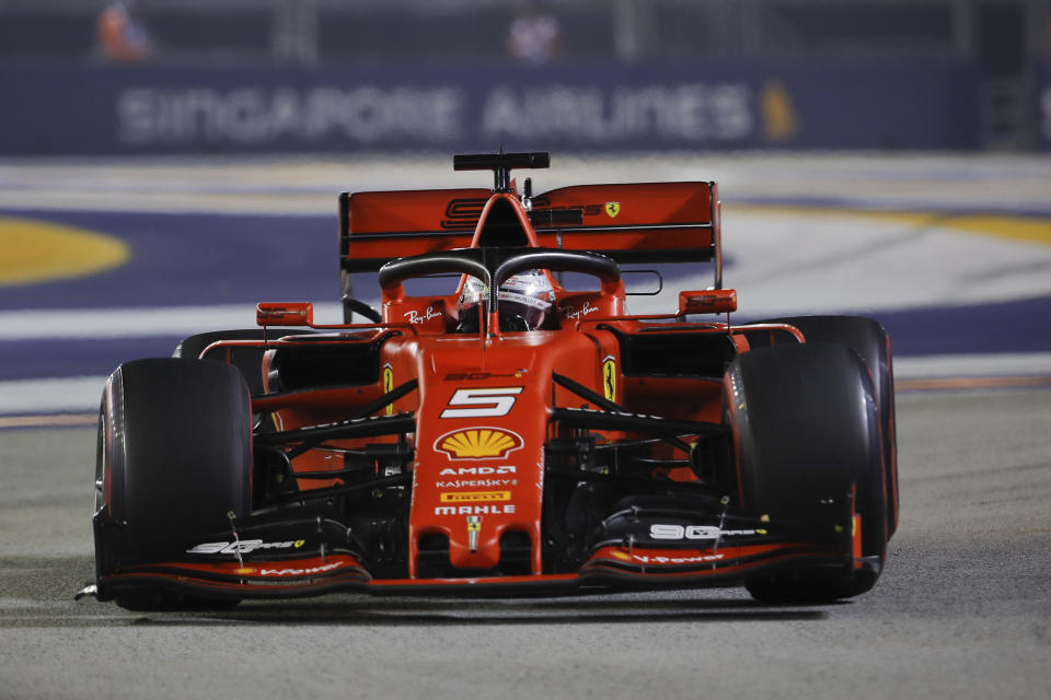 Ferrari driver Sebastian Vettel of Germany steers his car during the Singapore Formula One Grand Prix, at the Marina Bay City Circuit in Singapore, Sunday, Sept. 22, 2019. (AP Photo/Vincent Thian)