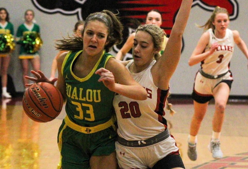Idalou's Logan Heard (left) is bumped by Shallowater's Kinleigh Richardson during a District 2-3A girls basketball game on Friday, January 13, 2023 at Shallowater.