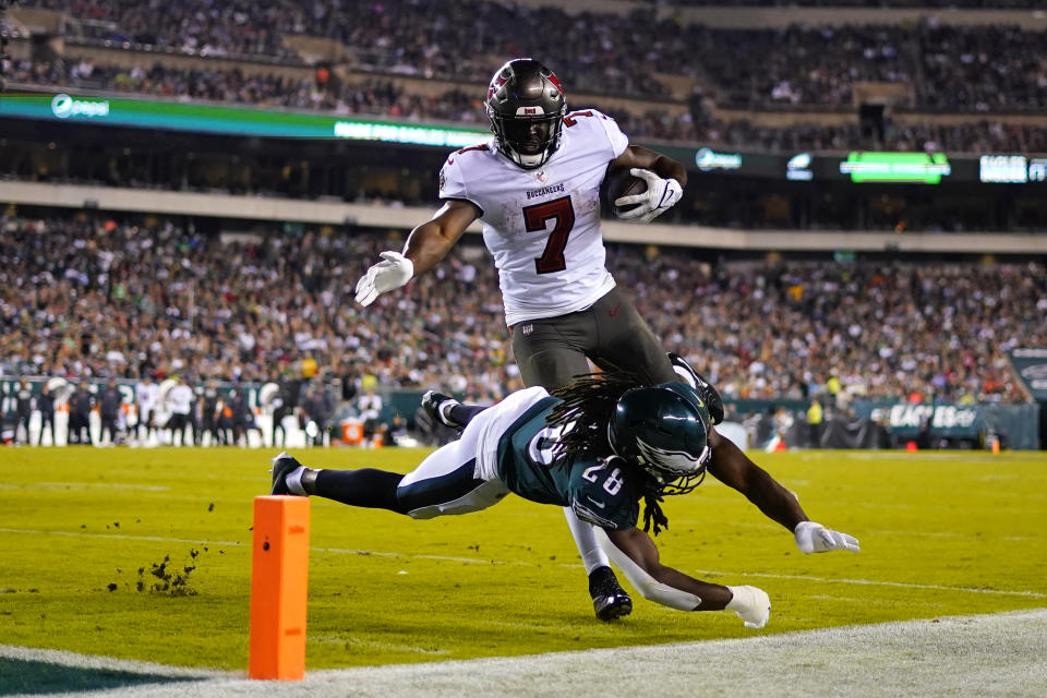 Philadelphia Eagles free safety Anthony Harris (28) stops Tampa Bay Buccaneers running back Leonard Fournette (7) during the second half of an NFL football game Thursday, Oct. 14, 2021, in Philadelphia. (AP Photo/Matt Slocum)