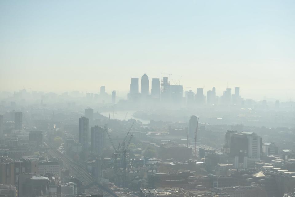 A smoggy cloud over Canary Wharf shows dense pollution in London (Jeremy Selwyn)