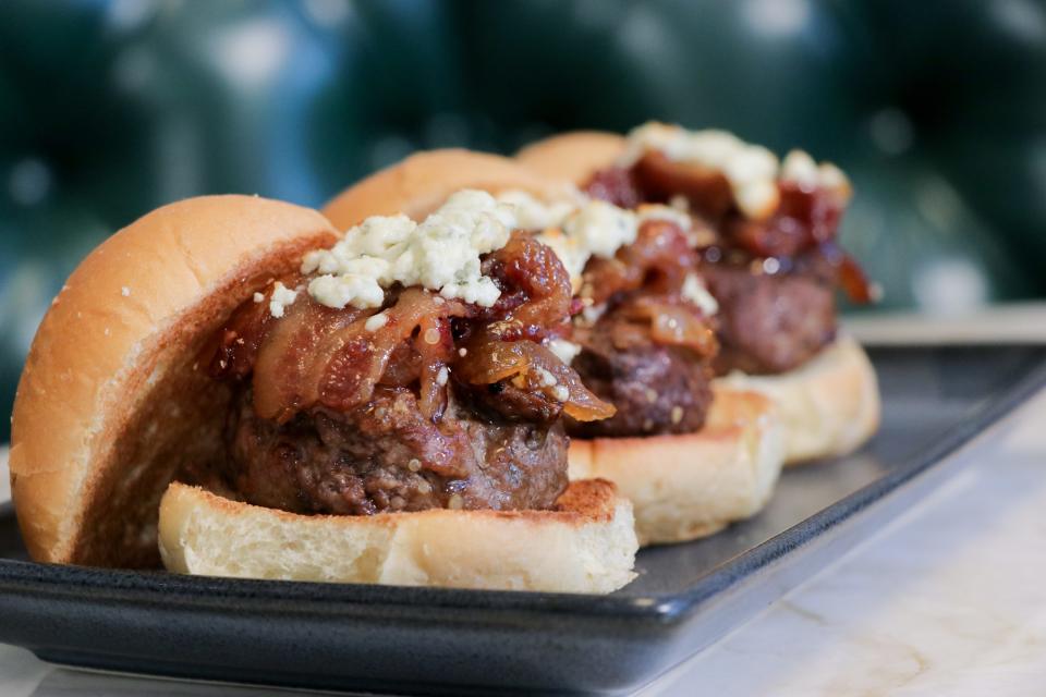 A trio of generously topped wagyu sliders at Bar 25 in Delray Beach.