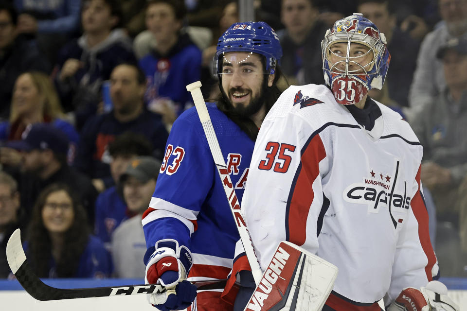 New York Rangers center Mika Zibanejad (93) and Washington Capitals goaltender Darcy Kuemper react after Zibanejad sent a shot wide of Kuemper during the first period of an NHL hockey game Wednesday, Dec. 27, 2023, in New York. (AP Photo/Adam Hunger)