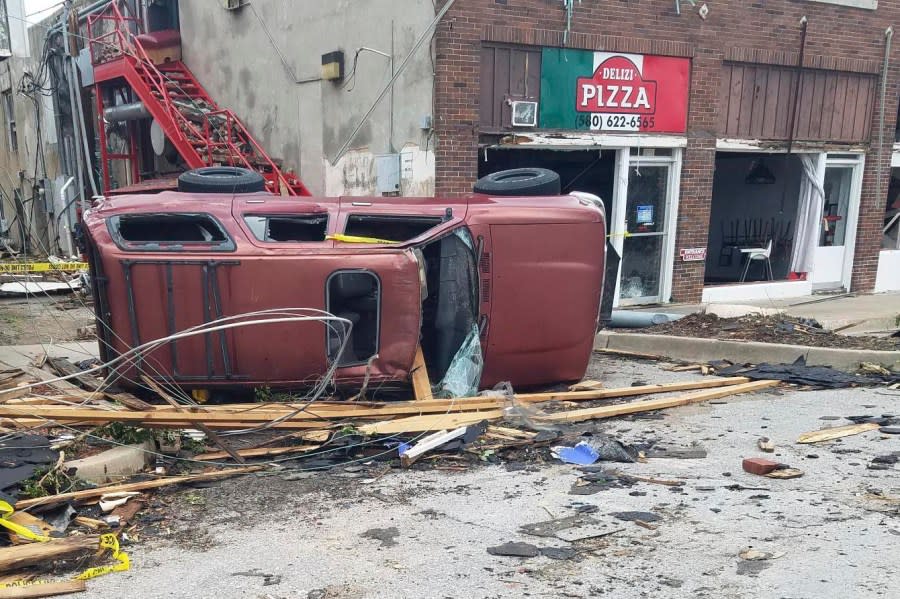 A car lies knocked over on its side after a tornado tore through Sulphur, Okla., Sunday, April 28, 2024. (AP Photo/Ken Miller)