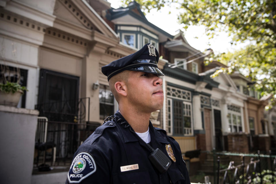 CAMDEN, NJ - AUGUST 22:  Officer Adam Fulmore, of the Camden County Police Department, goes on a foot patrol on August 22, 2013 in the Parkside neighborhood of Camden, New Jersey. The town of Camden, which was once a large industrial town but watched it's population dwindle as manufacturing left, has been marred with societal problems including high unemployment, crime, murder and heavy drug trafficking for decades. The Camden County Police Department was officially created in May, 2013, after the unionized Camden Police department was disbanded. The overhaul, which was supported by New Jersey Governor Chris Christie, has been considered unprecendented and has been closely watched around the country. The new force currently has approximately 280 members, and will reach full size by December, with 400 members. Early signs suggest the overhaul has been effective - The Wall Street Journal reported earlier this month that Camden murder rates fell 29% from May, 2013 to July 2013, compared to the same period last year. Absentee rates of the CCPD is also lower: approximately 5% of officers have been reported absent so far, compared to approxmiately 30% of the Camden Police Department prior to the change in command.  (Photo by Andrew Burton/Getty Images)