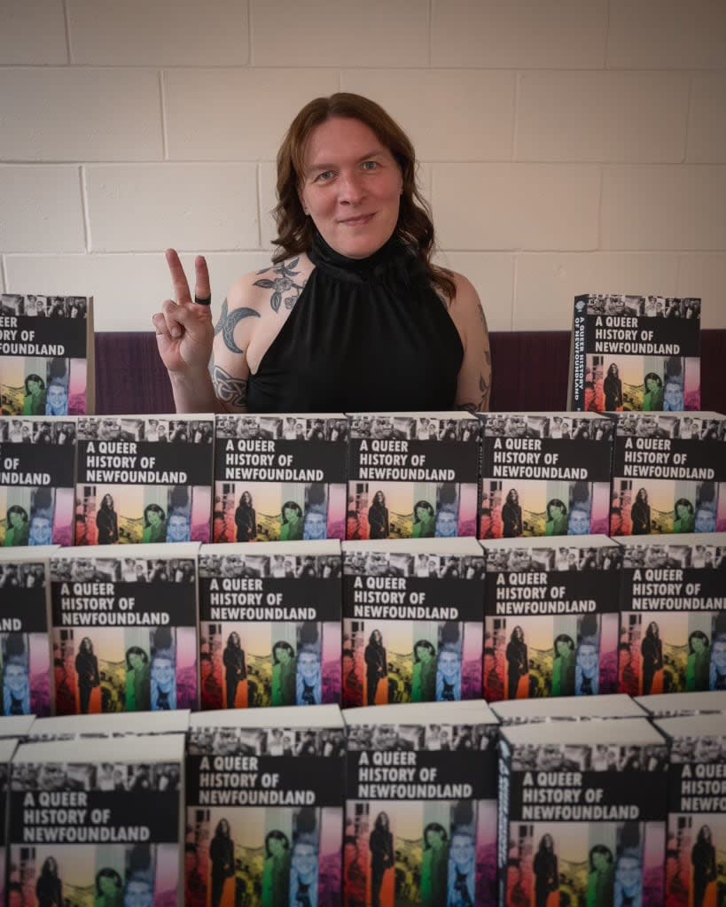 Rhea Rollmann with copies of her new book, ‘A Queer History of Newfoundland.’