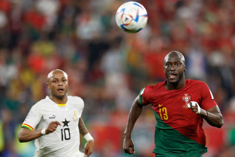 Portugal's defender #13 Danilo Pereira (R) chases the ball with Ghana's midfielder #10 Andre Ayew (L) during the Qatar 2022 World Cup Group H football match between Portugal and Ghana at Stadium 974 in Doha on November 24, 2022. (Photo by Khaled DESOUKI / AFP) (Photo by KHALED DESOUKI/AFP via Getty Images)