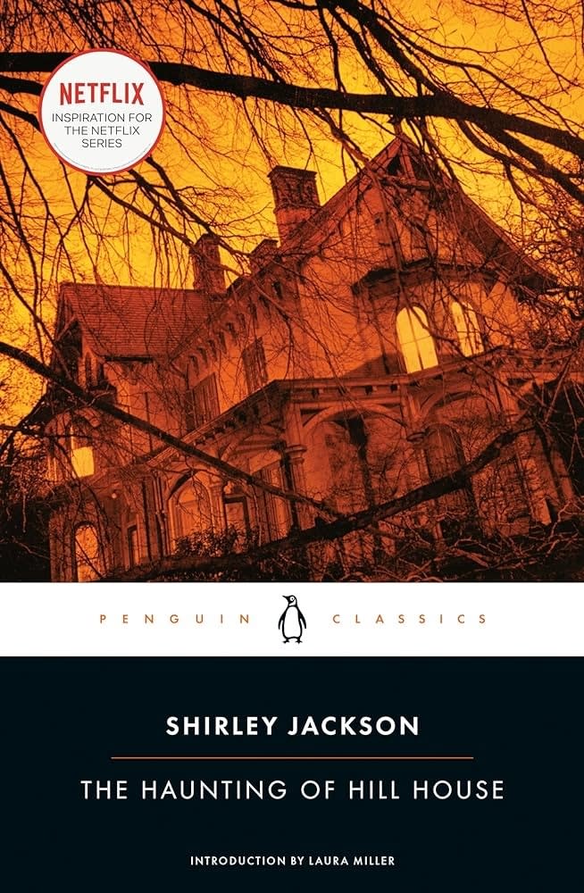 Cover of "The Haunting of Hill House" book, with a silhouette of a spooky house against a twilight sky, Netflix series mentioned