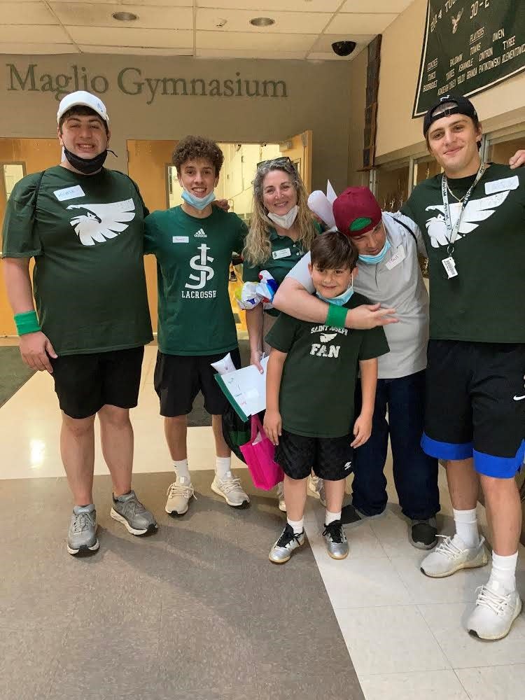 Thomas Freda (second from left) with family members and members of Falcons and Friends