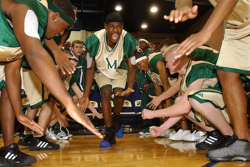 LeBron James is introduced before St. Vincent-St. Mary faced Buchtel High School in 2001 at the University of Akron's Rhodes Arena.