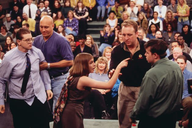Security guard Steve Wilkos (second from left) and another guard separate and restrain fighting guests on the 