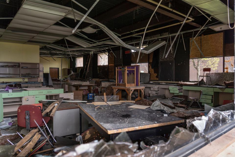 A destroyed classroom is seen through a shattered window at the former Flint Northern High School in Flint on Thursday, April 18, 2024.