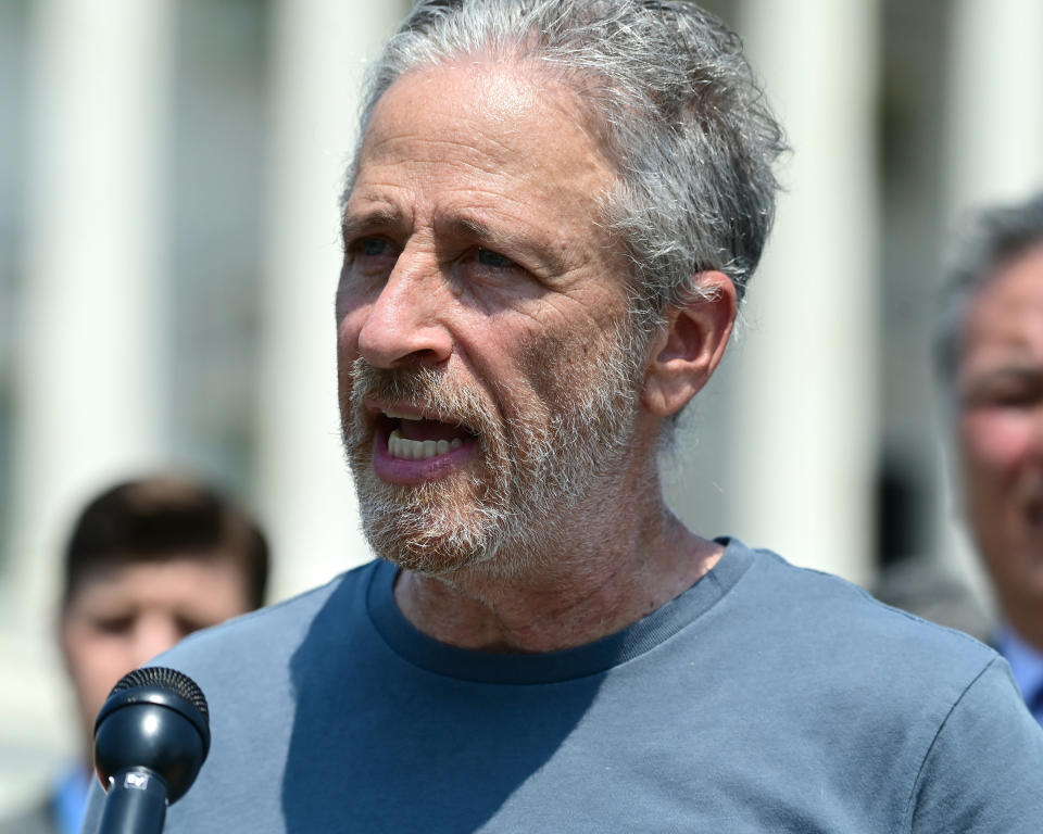 Jon Stewart speaks at podium