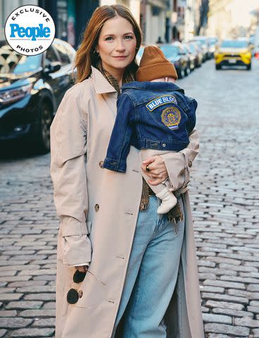 <p>Jenny Anderson</p> Vanessa Ray and son Isaac, wearing a 'Blue Bloods' jacket