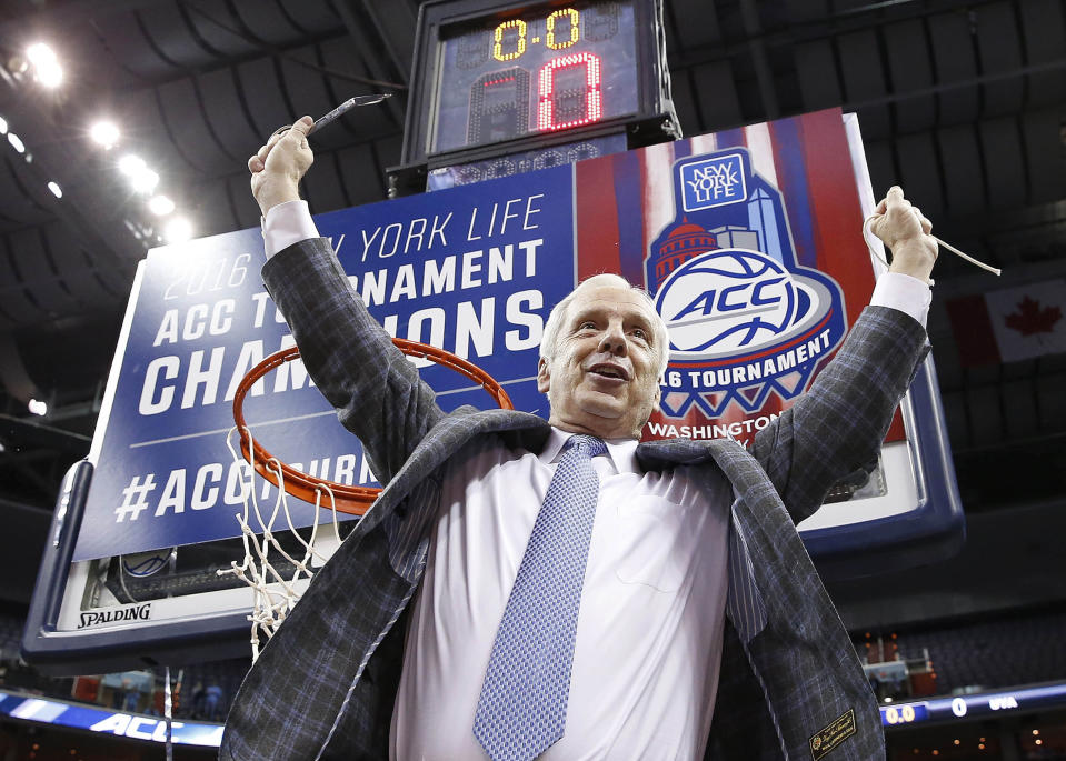 FILE - North Carolina head coach Roy Williams holds part of the net after an NCAA college basketball game in the championship of the Atlantic Coast Conference tournament against Virginia in Washington, in this Saturday, March 12, 2016, file photo. North Carolina announced Thursday, April 1, 2021, that Hall of Fame basketball coach Roy Williams is retiring after a 33-year career that includes three national championships. (AP Photo/Alex Brandon, File)