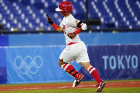 Japan's Yu Yamamoto reacts after hitting a two-run home run during a softball game against Italy at Yokohama Baseball Stadium during the 2020 Summer Olympics, Saturday, July 24, 2021, in Yokohama, Japan. (AP Photo/Matt Slocum)