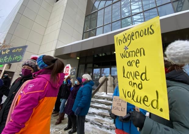 Sasha Sywulsky held a sign that read 'Indigenous Women are Loved and Valued.' She said the territory's justice system is failing when it comes to protecting women from violence.