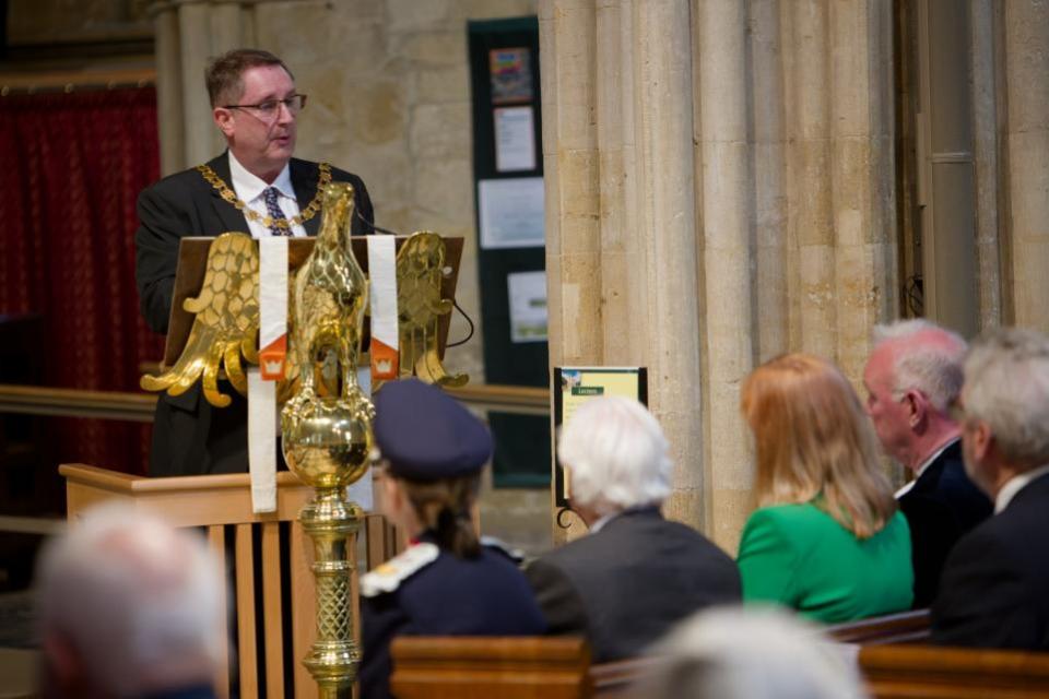 Worcester News: Cllr Robert Raphael delivers his address to those gathered inside Pershore Abbey