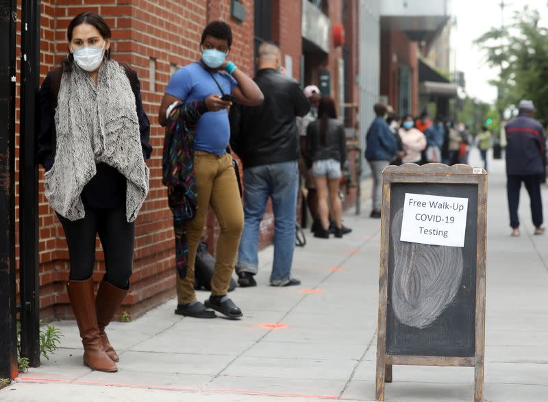 People wait in line for testing at the Bread for the City social services charity during the coronavirus disease (COVID-19) outbreak, in Washington