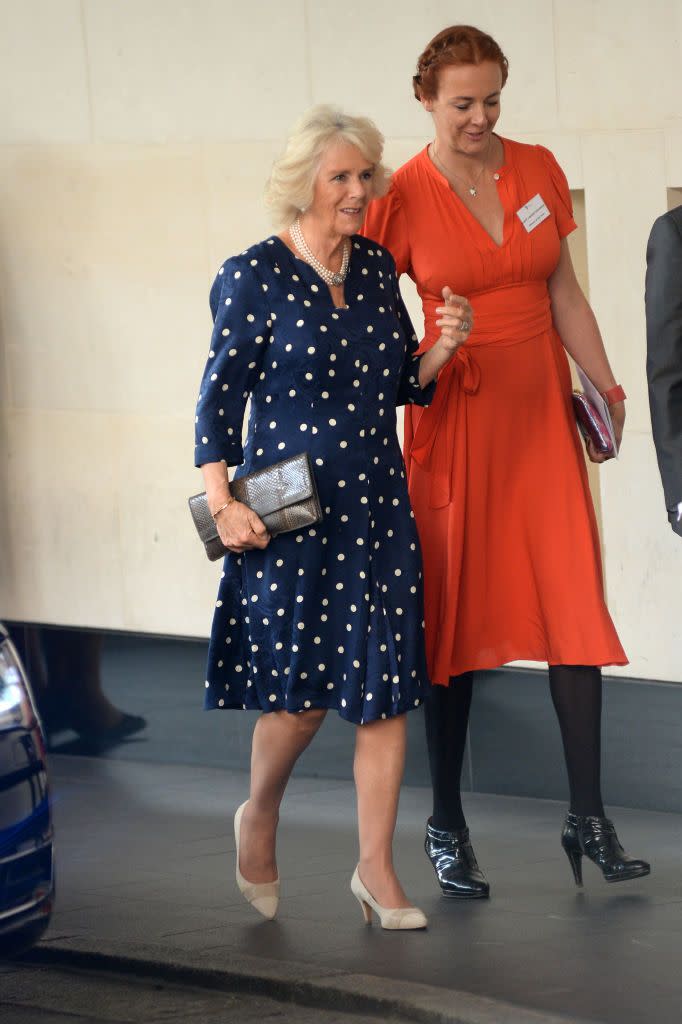 <p>Camilla brought a luxe touch to the Woman Of The Year Awards Lunch in London, England with this navy velvet polkadot dress. </p>