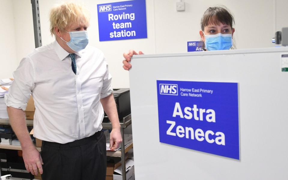 Boris Johnson sees the operation for distributing Oxford/Astrazaneca vaccine in London during a visit to a vaccination centre in the north of the capital - Stefan Rousseau/PA