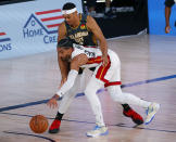 Miami Heat's Gabe Vincent, front, steals the ball from Oklahoma City Thunder's Darius Bazley, rear, during the second half of an NBA basketball game Wednesday, Aug. 12, 2020, in Lake Buena Vista, Fla. (Kevin C. Cox/Pool Photo via AP)