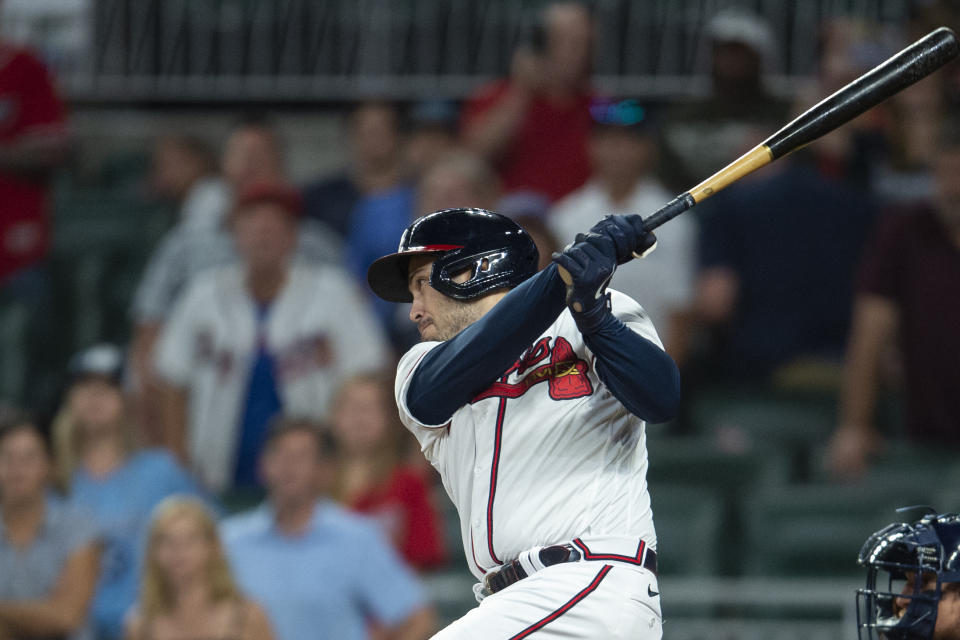 Atlanta Braves Travis d'Arnaud hits a walk off single in the eleventh inning of a baseball game against the Houston Astros Saturday, Aug. 20, 2022, in Atlanta. (AP Photo/Hakim Wright Sr.)