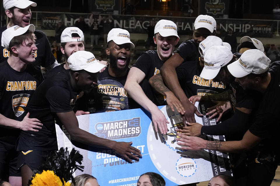 Northern Kentucky celebrates after defeating Cleveland State in an NCAA college basketball game for the Horizon League men's tournament championship Tuesday, March 7, 2023, in Indianapolis. (AP Photo/Darron Cummings)