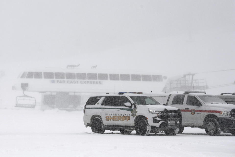 Placer County sheriff vehicles are parked near the ski lift at Palisades Tahoe where avalanche occurred on Wednesday, Jan. 10, 2024, in Tahoe, Calif. (AP Photo/Andy Barron)