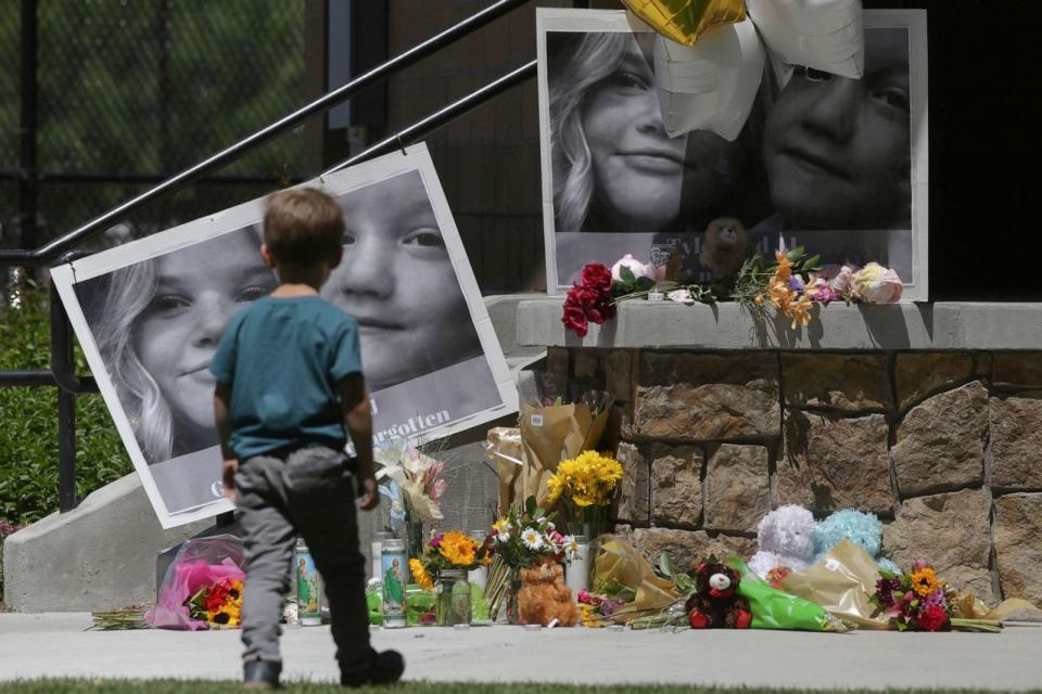 PHOTO: In this June 11, 2020 file photo a boy looks at a memorial for Tylee Ryan and Joshua 'JJ' Vallow in Rexburg, Idaho. (John Roark/The Idaho Post-Register via AP, FILE)